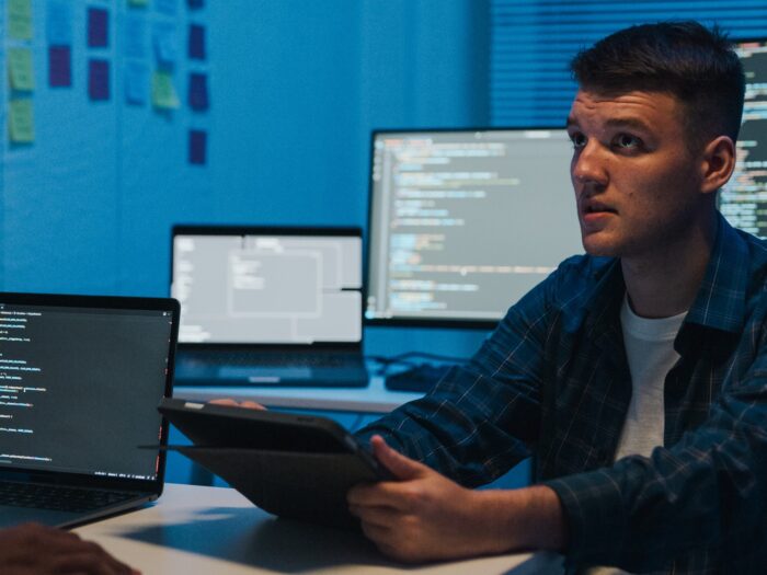 Group of IT professionals collaborating on network security and data analysis