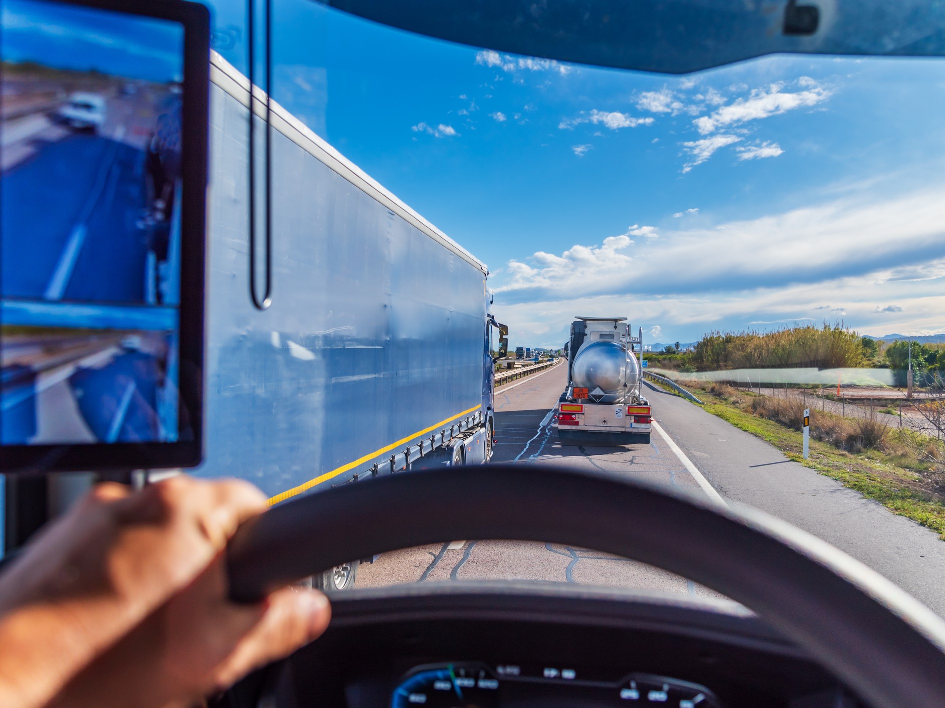 Truck overtaking two other trucks