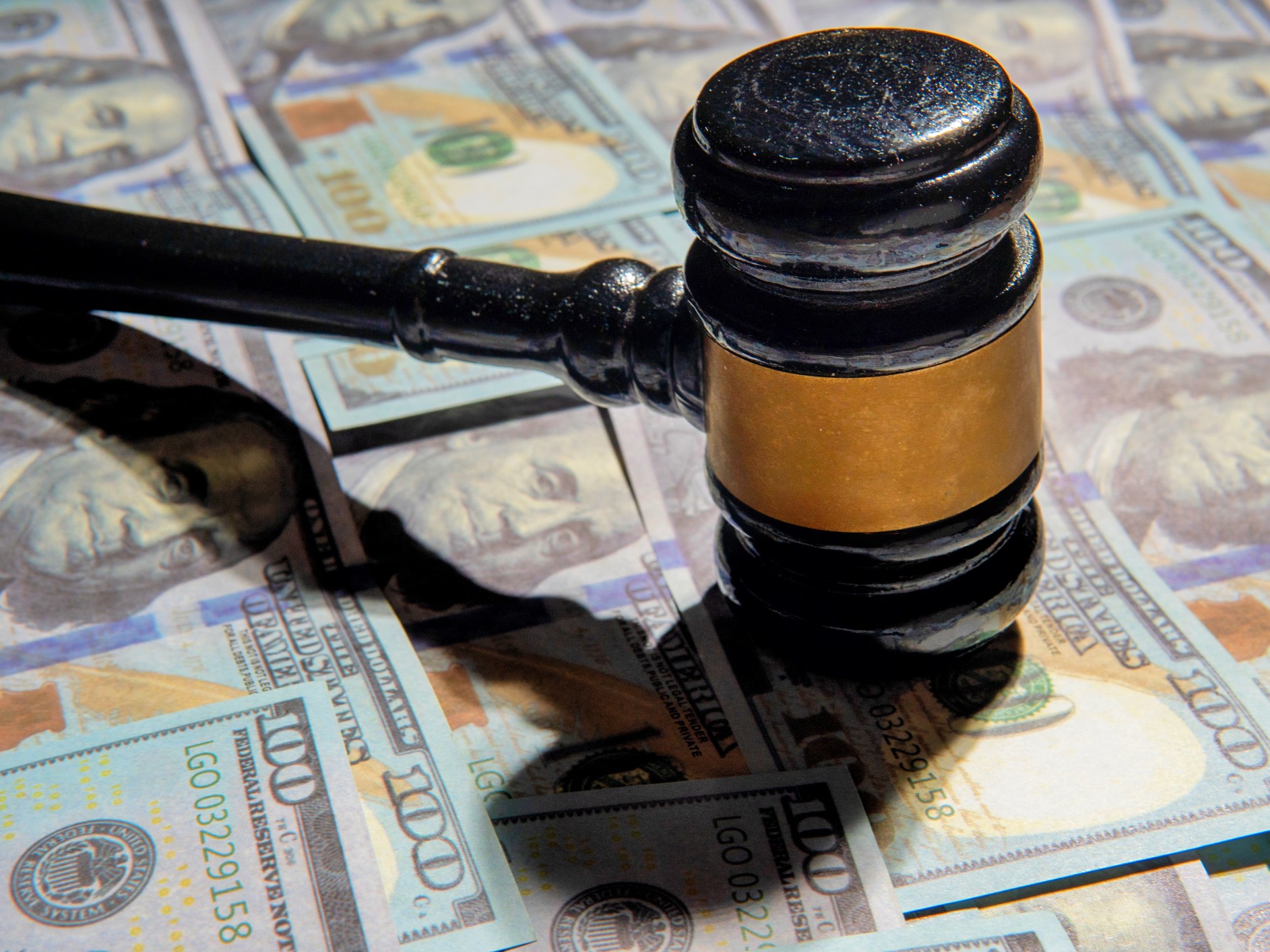 Closeup image of gavel and money
