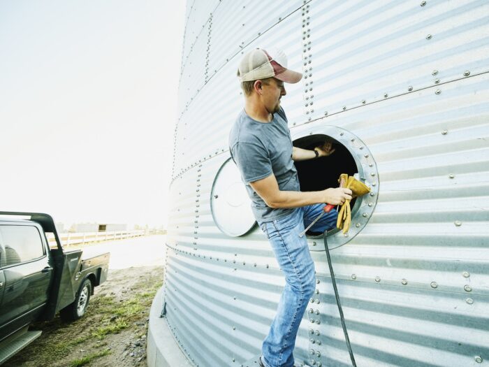 farmer entering grain silo