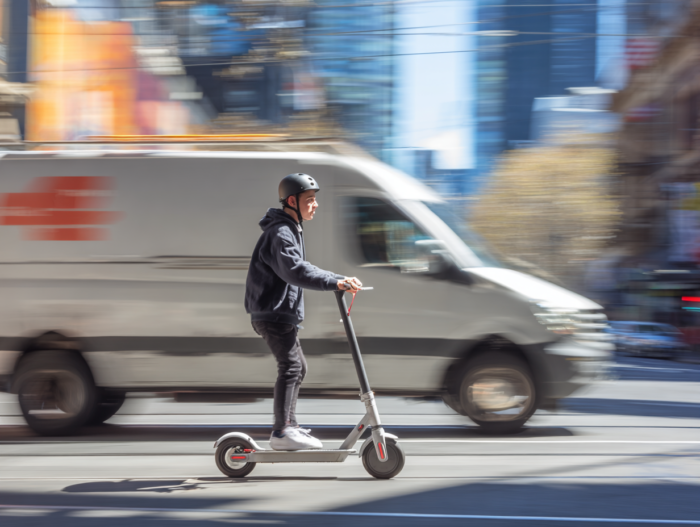 e-scooter amid busy traffic concept