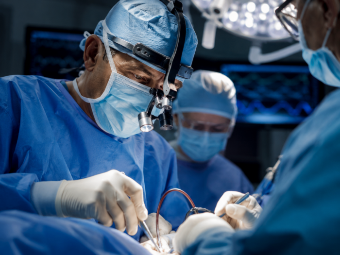 surgeons performing a high-exposure procedure concept